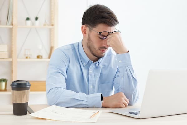 Stressed Man At A Computer