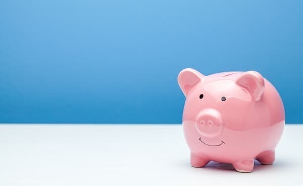 Pink Piggy Bank On A Blue Background